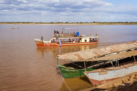 Tourists in a touristic barge along the river Tsiribihina, Western Madagascar on June 30, 2017のeditorial素材