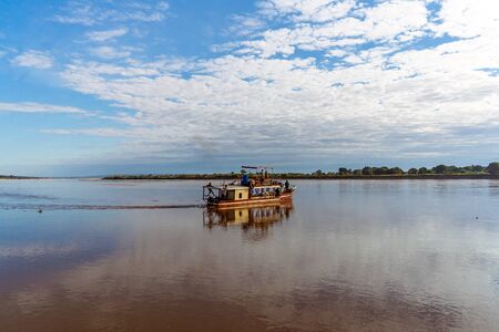 Tourists in a touristic barge along the river Tsiribihina, Western Madagascar on June 30, 2017のeditorial素材