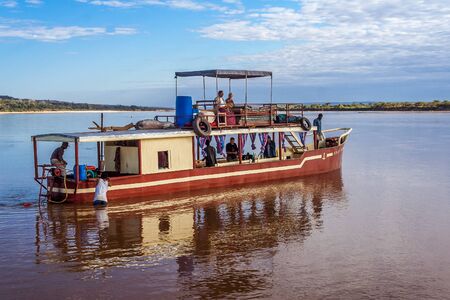 Tourists in a touristic barge along the river Tsiribihina, Western Madagascar on June 30, 2017のeditorial素材