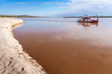 Tourists in a touristic barge along the river Tsiribihina, Western Madagascar on June 30, 2017のeditorial素材
