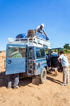 Tourists with a all-terrain vehicle from transport on the bush of Madagascar on july 3, 2017のeditorial素材