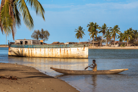 Malagasy villager of Vezo ethnicity rowing in his dugout canoe in Belo sur Mer, western Madagascar on October, 28, 2016のeditorial素材