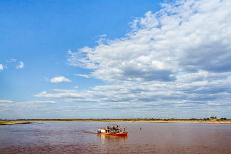 Tourists in a touristic barge along the river Tsiribihina, Western Madagascar on June 30, 2017のeditorial素材