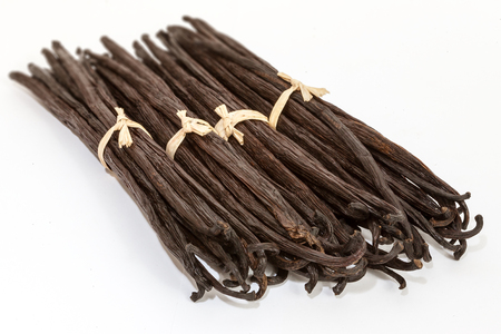 Bundles of vanilla pods from Madagascar tied with raffiaの写真素材