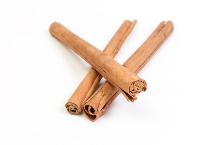 Sticks of cinnamon isolated on white backroundの写真素材
