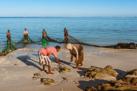 Tsifota, Madagascar, June 08, 2017: Fishing scene of Malagasy fishermen of the Vezo ethnic group in the edge of the Ambatomilo lagoon in southwestern Madagascarのeditorial素材