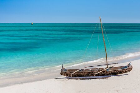 Outrigger canoe, traditional Vezo fishing boat beached in the lagoon of south-western Madagascarの写真素材