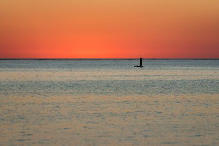 Malagasy fishing sailboat at sunset in southwestern Madagascarの写真素材