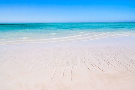 Clear waters and white sand beach of the lagoon in south-western Madagascarの写真素材