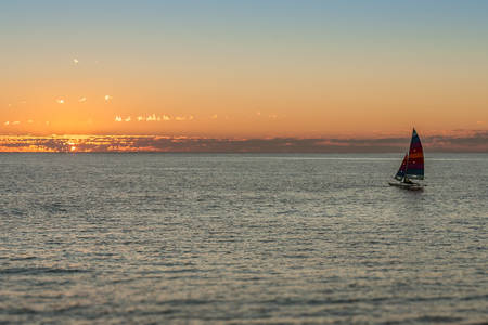 sailing boat at sunset in the lagoonの写真素材