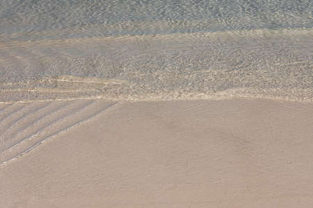 Soft wave on the sandy beach of the lagoonの写真素材