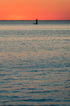 Malagasy fishing sailboat at sunset in southwestern Madagascarの写真素材