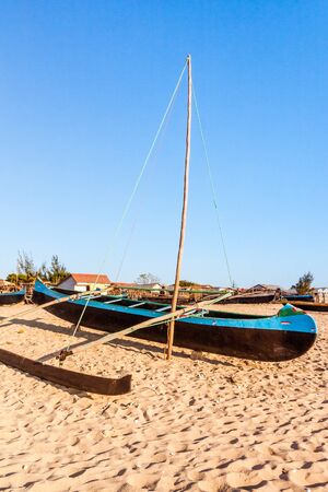 Fishing dugout beached to Anakao, southern Madagascarの写真素材