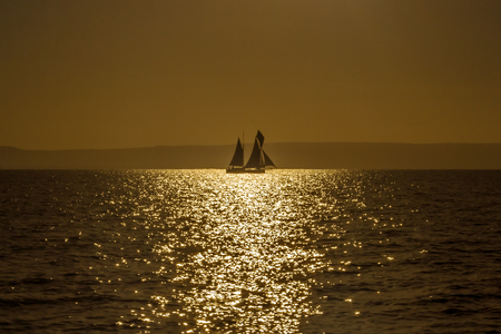 Malagasy dhow at golden hour off the coast of Anakao, southern Madagascarの写真素材