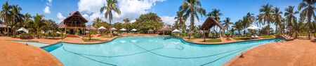 Swimming pool of a luxurious tropical hotel on the seafrontの写真素材