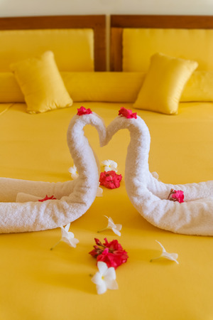 Romantic two towels on the bed of a luxury hotelの写真素材