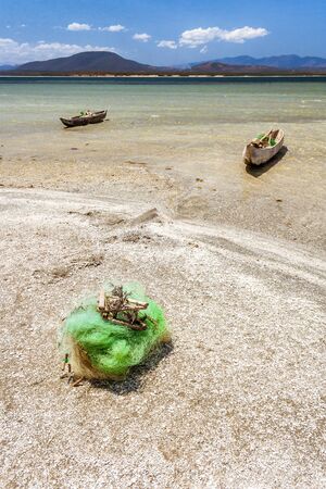 Fishing boats and net  in the Anony salted lake near Tolanaro (Fort-Dauphin) in southern Madagascarの写真素材