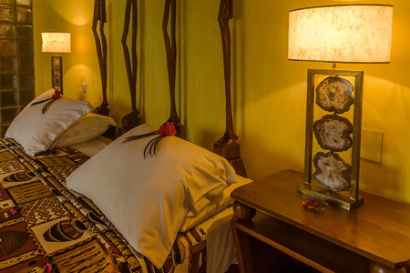 Luxury tropical hotel room with precious wood furnitureの写真素材