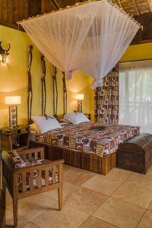 Luxury tropical hotel room with precious wood furnitureの写真素材
