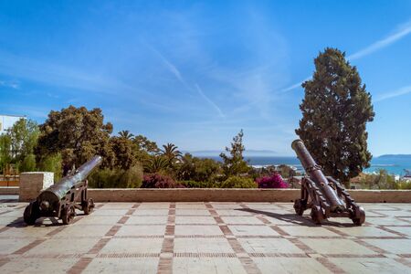 The cannons of the terrace of the lazy in Tangier, north of Morocco with view on the Straits of Gibraltarの写真素材