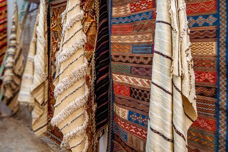 Moroccan  carpets in the street shop souk of Asilah, Moroccoの写真素材