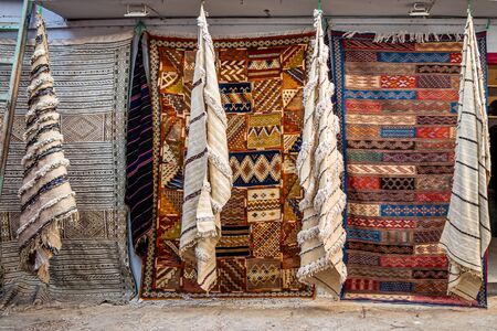 Moroccan  carpets in the street shop souk of Asilah, Moroccoの写真素材