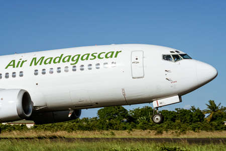 An Air Madagascar Boeing 737 taking off from Sambava airport in Madagascar on January 14, 2019のeditorial素材