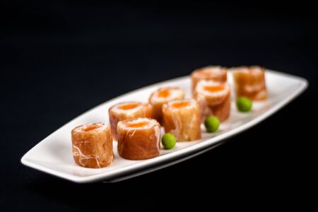 Maki rolls strapped with cured hamの写真素材
