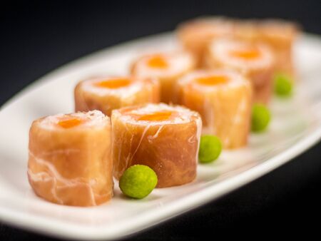 Maki rolls strapped with cured hamの写真素材