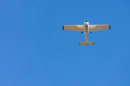 A private plane flying isolated on blue sky