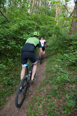 Cycling through the paths in the woodsの写真素材