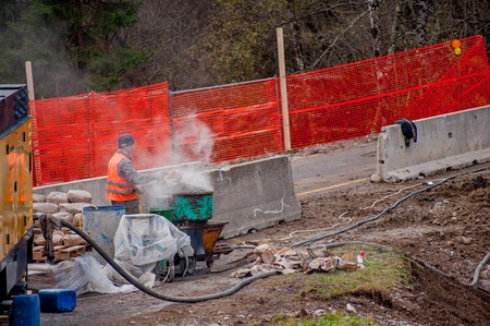 Over the Colle Bergamo Italy November 11, 2017: Carpentry workers to build sewage purifiersのeditorial素材