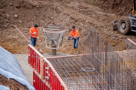 Over the Colle Bergamo Italy November 11, 2017: Carpentry workers to build sewage purifiersのeditorial素材