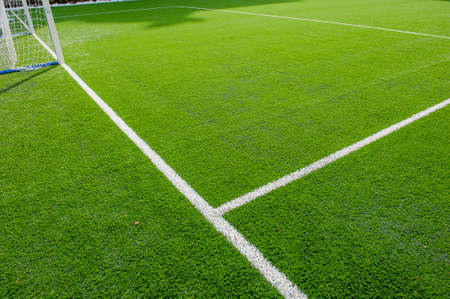 corner in the football field with artificial turf flag