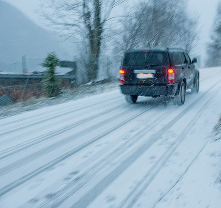 trip by car during the snowfallの写真素材