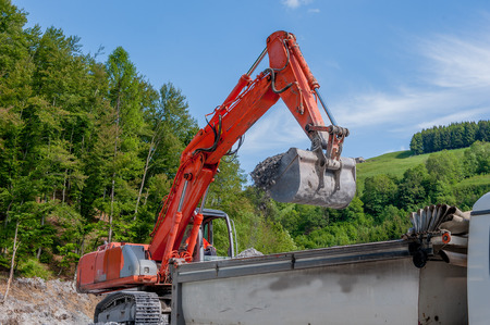 load of gravel with bulldozer in construction site