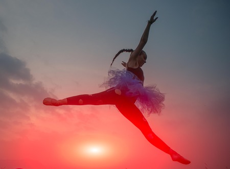 girl jumping lightの写真素材
