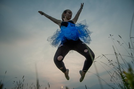 girl jumping lightの写真素材