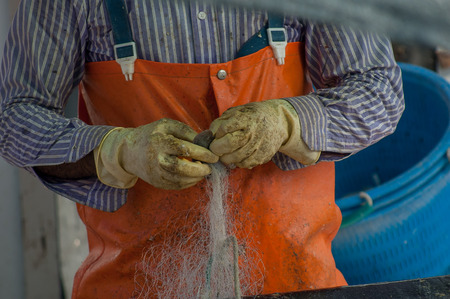 cleaning of fishing netsの写真素材