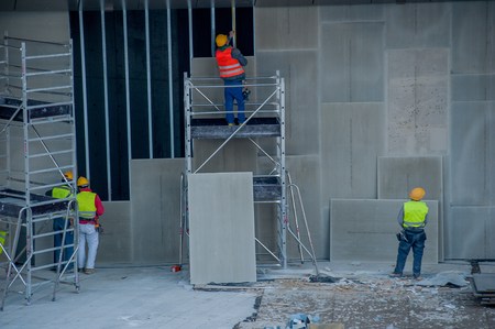 workers to work with high visibility clothingの写真素材