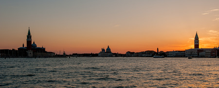 venice at sunset with reflections in the seaの写真素材