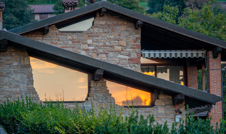 renovated house a sun reflecting in the windows