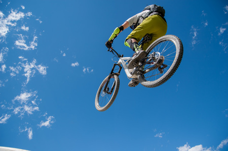 Livigno italy July 27th 2015:boy who finishes the descent by bike with a jumpのeditorial素材