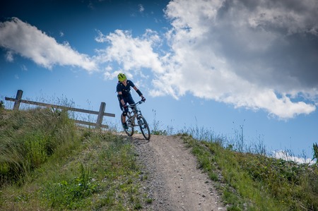 Livigno italy 27th July 2015: descent along the ski slope by bikeのeditorial素材