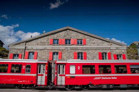 Bernina Switzerland 27July 2015: hospice railway station red train berninaのeditorial素材