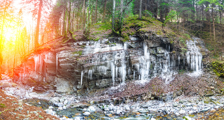 stalactites of ice on steep rockの写真素材