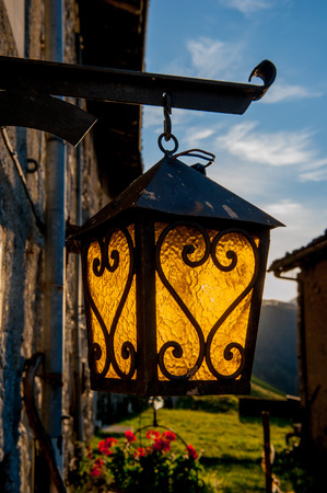 old lantern hanging outside a cottageの写真素材