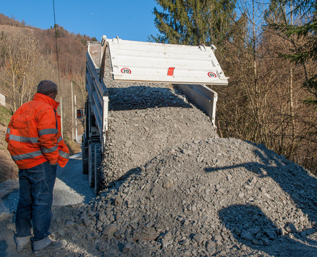 rollover of gravel from trucksの写真素材