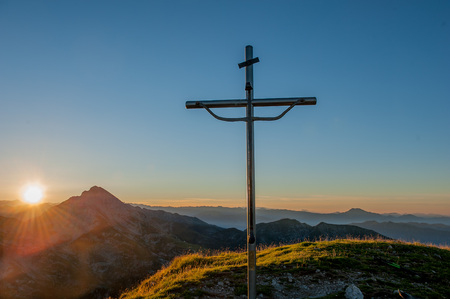 crucifix placed on top of the mountainの写真素材