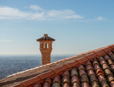 Roof with ancient Coppi and chimneysの写真素材